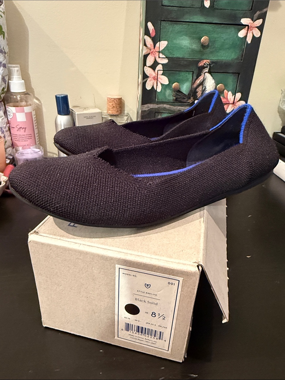 Rothy’s Black “The Daily Flat” Slip-On shoes with Blue Trim - Women